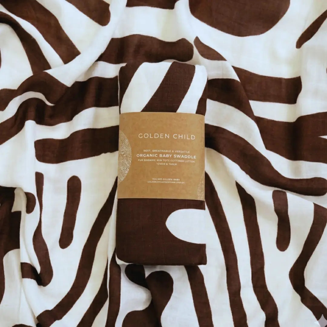 Golden Child Holiday Patterned Baby Swaddle - Choco & Milk