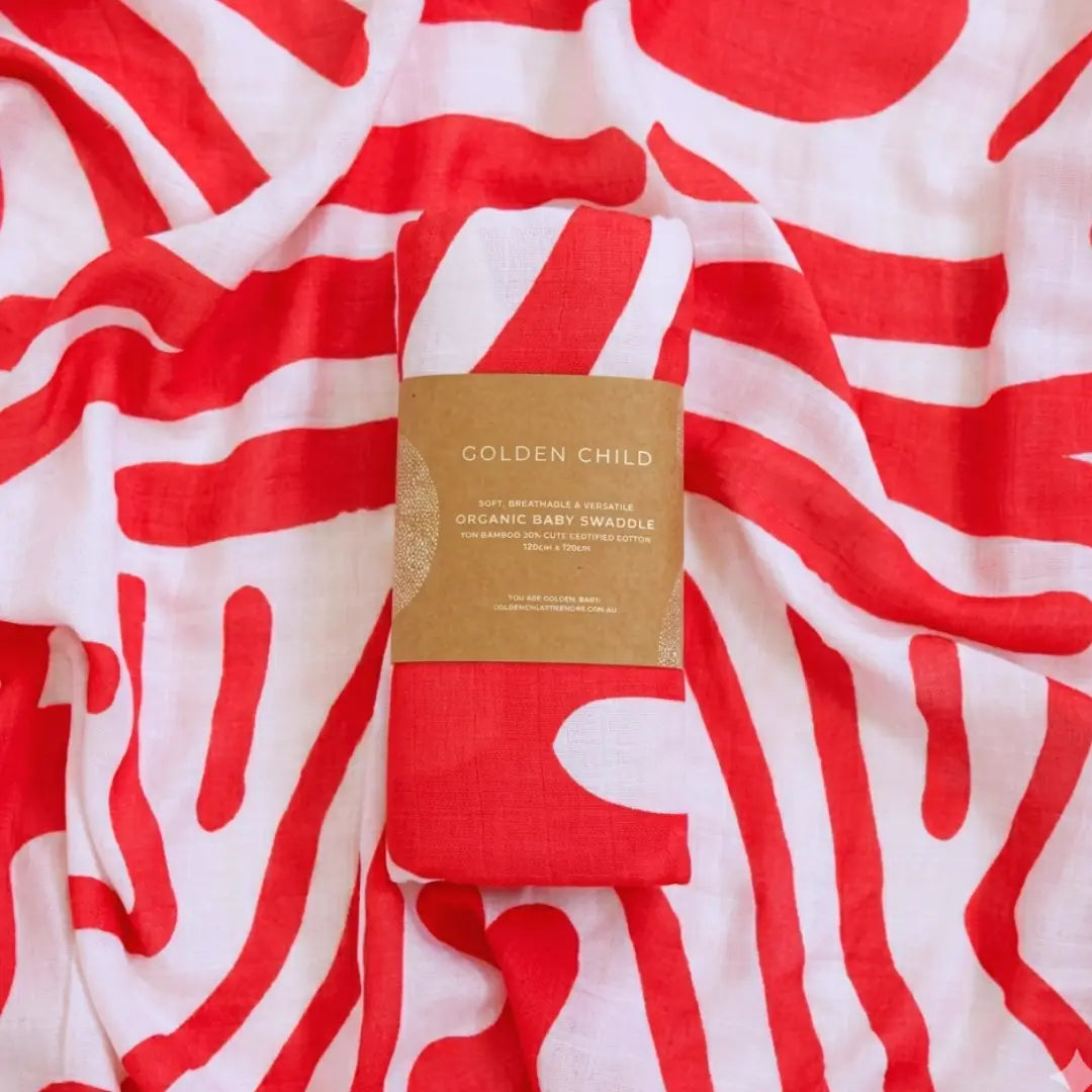 Golden Child Holiday Patterned Baby Swaddle - Red & Milk