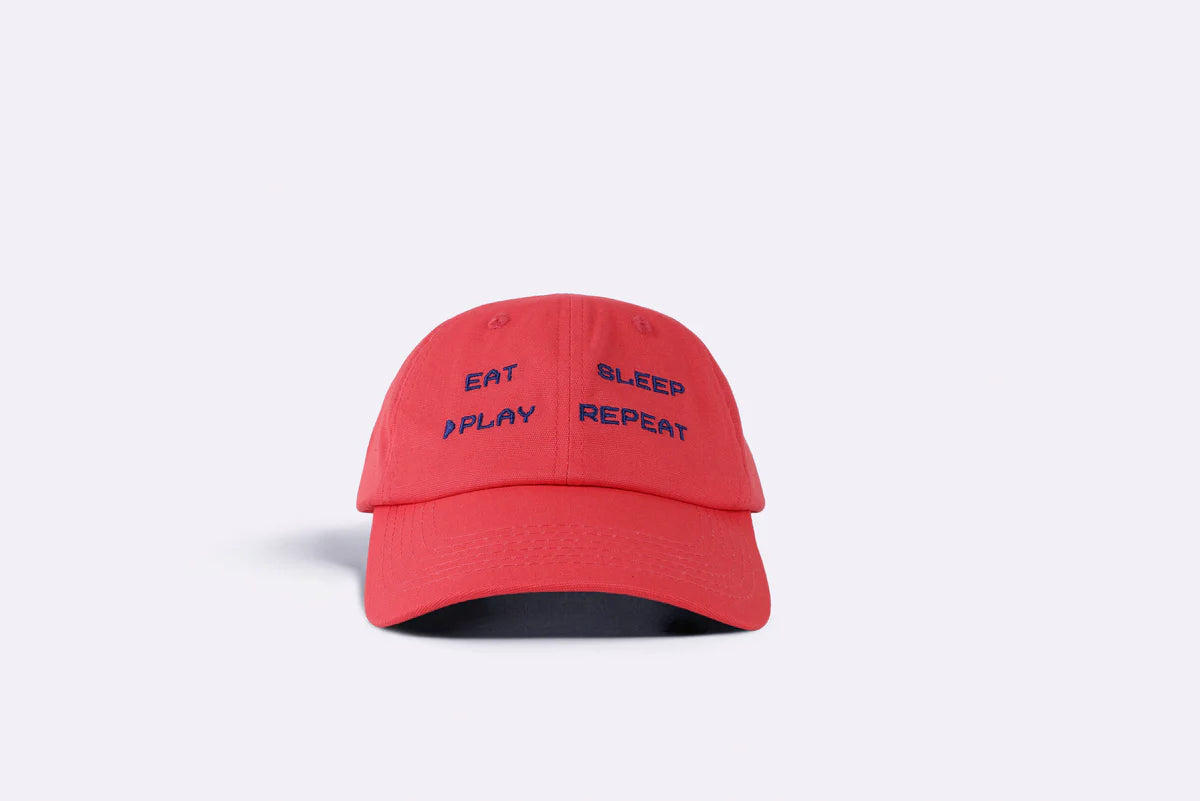 Eat, Sleep, Play, Repeat dad cap in coral