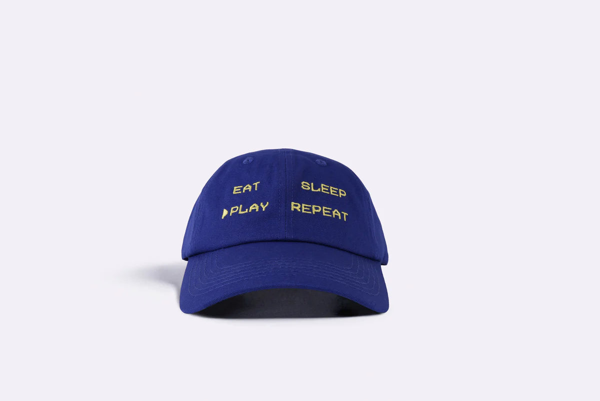Eat, Sleep, Play, Repeat dad cap in cobalt blue